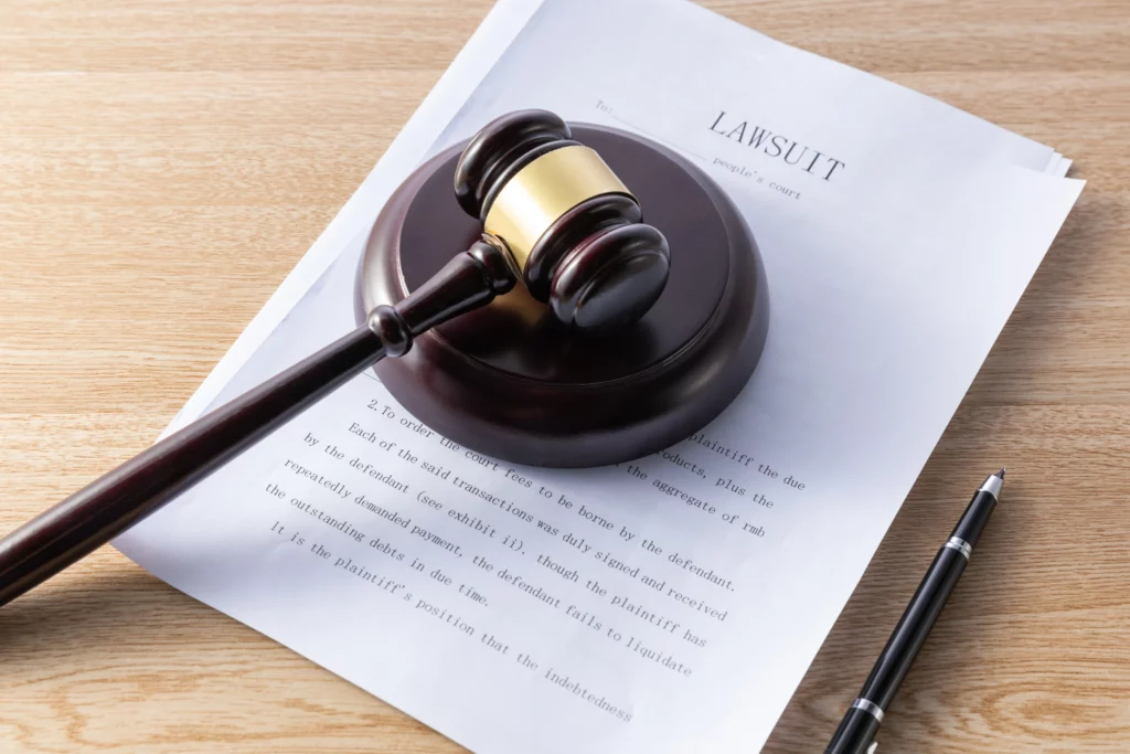 Judge’s gavel resting on a lawsuit document, illustrating how bankruptcy can stop lawsuits in Kentucky.